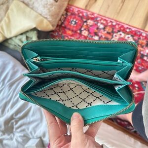 Teal Kate Spade wallet. White and black interior